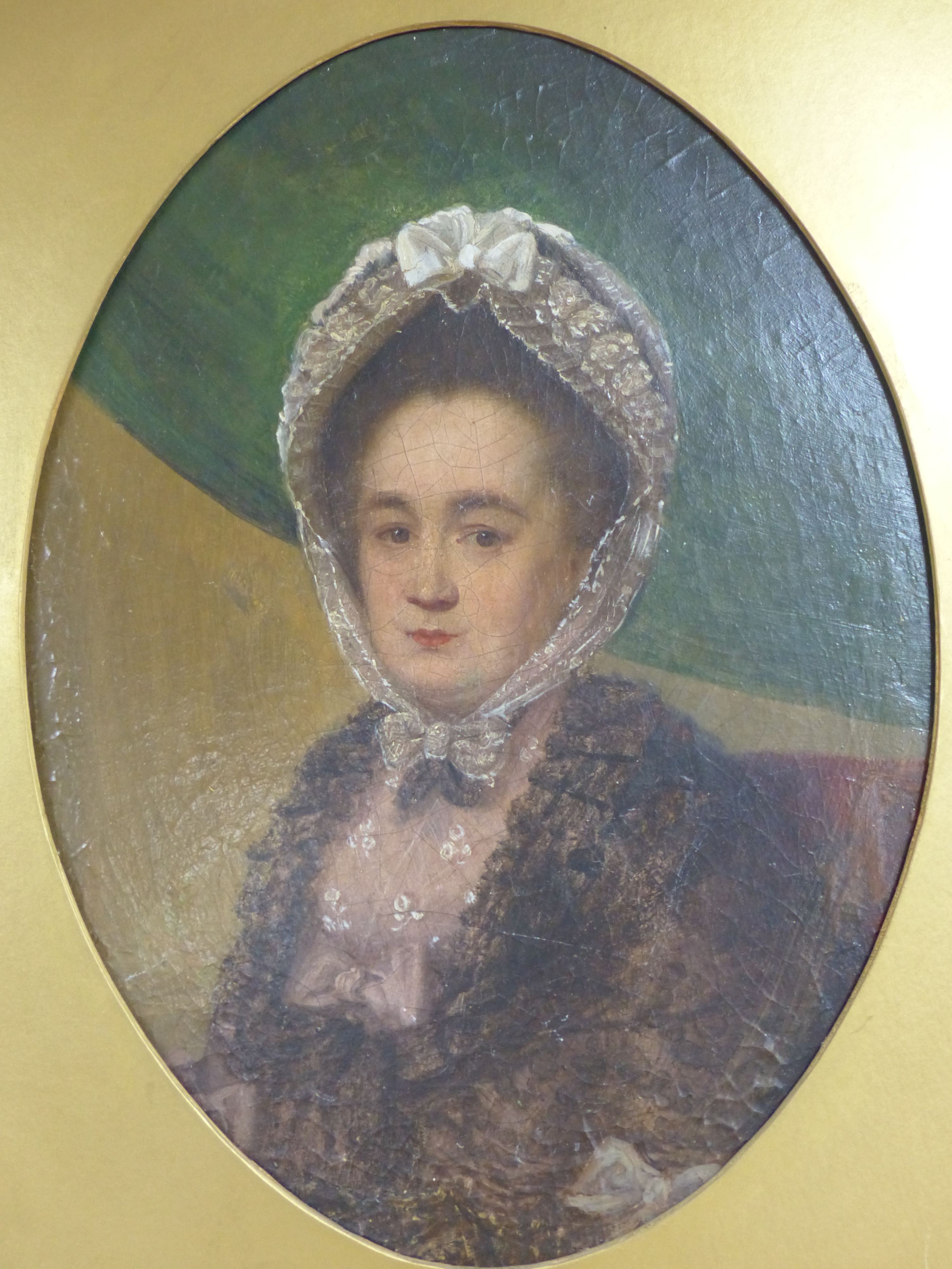 Victorian School, oil on board, Portrait of a lady wearing a lace bonnet, oval, 35 x 25cm